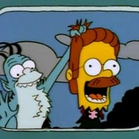 The gremlin from the bus holding Ned's severed head