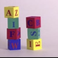 Knocking Over Stacked Letter Blocks (Language Nursery)